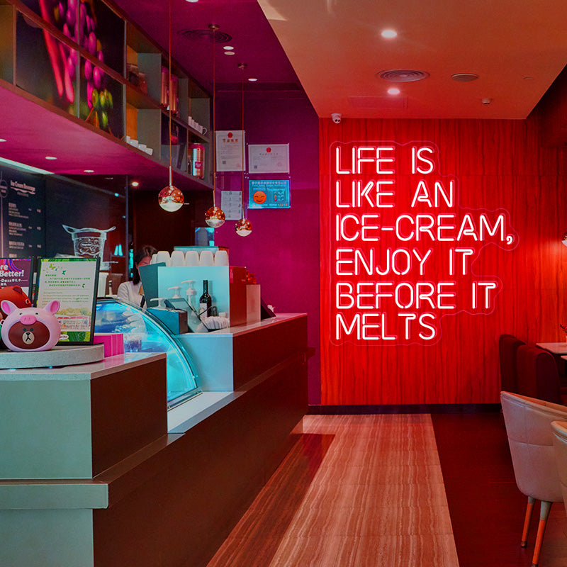 LIFE IS LIKE AN ICE-CREAM, ENJOY IT BEFORE IT MELTS neon sign in the colour red. Neon sign produced by Neon Partys.