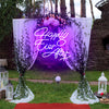 Happily Ever After X neon light in the color purple. The neon light is hanging on a decorate arch at a wedding ceremony. Neon sign produced by Neon Partys. 