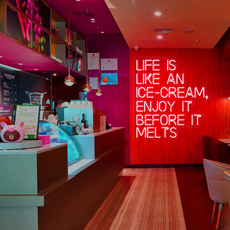 LIFE IS LIKE AN ICE-CREAM, ENJOY IT BEFORE IT MELTS neon sign in the colour red. Neon sign produced by Neon Partys. 