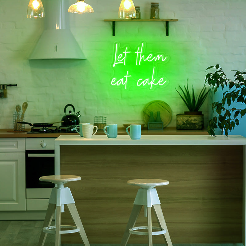 let them eat cake neon light in the color green. Neon light installed into the wall in kitchen. Neon sign available to order online at Neon Partys. 
