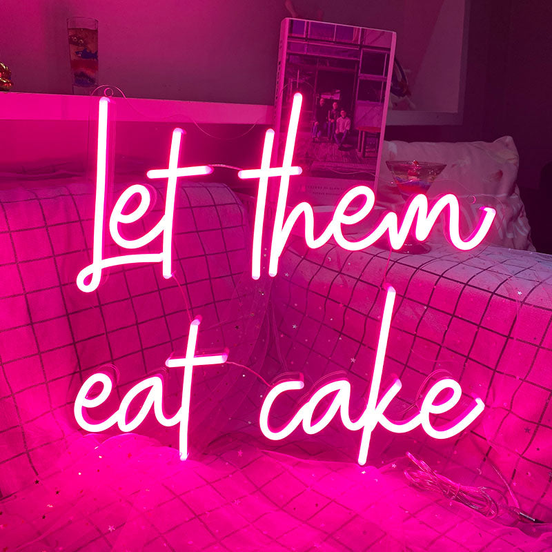 let them eat cake neon sign in deep pink. Neon sign produced by Neon Partys. 